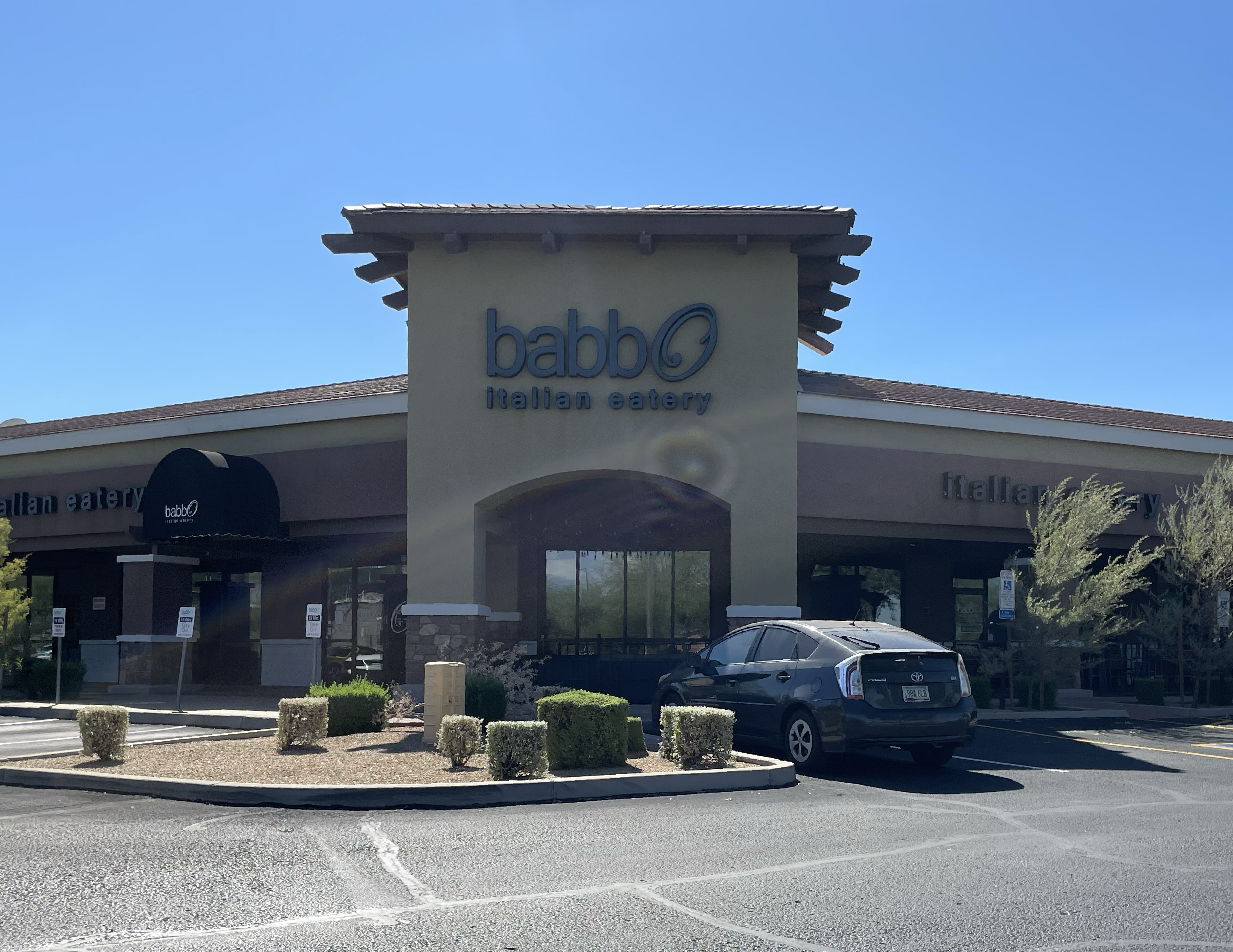 Office or retail commercial windows in Arizona with professional window film application underway.