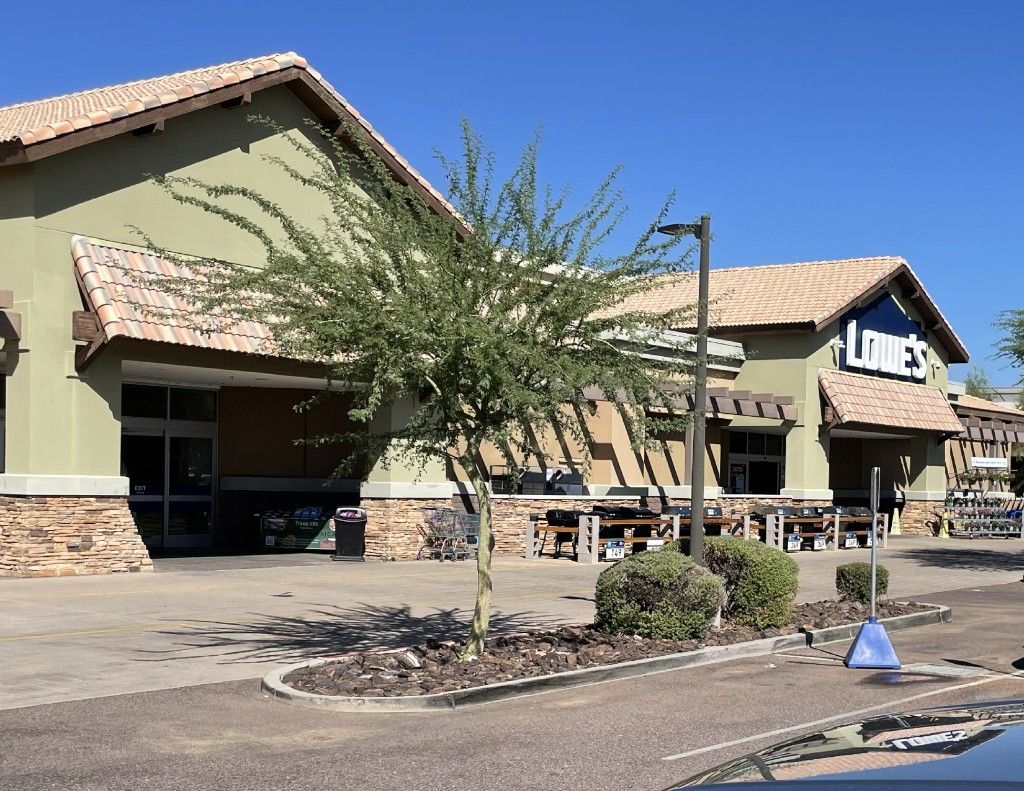 Large retail storefront with stone veneer and landscaping
